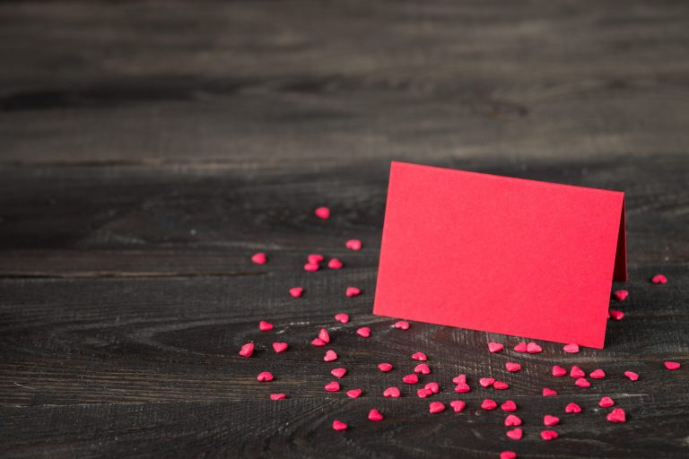 valentines-day-background-with-heart-card-and-gift-QWUGFTC-scaled